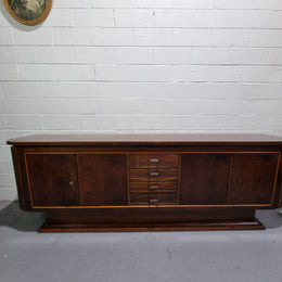 Amazing French Walnut Art deco four door buffet. The doors either side open to a fixed shelf and plenty of added storage with four drawers. In good original detailed condition.