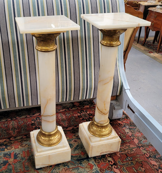 Pair of Imposing French alabaster marble and bronze pedestals. They are highly decorative and have been sourced from France. They are in good original detailed condition.