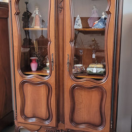 French Walnut Louis XV Style two half glass, door bookcase with three adjustable shelves. Sourced from France and in good original detailed condition.