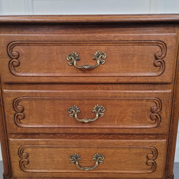 French Oak Louis XV style side drawers with lovely handles and three drawers. It has been sourced from France and is in good original detailed condition.