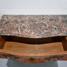 Attractive French marble top Louis XV style three drawer commode with decorative ormolu mounts. In good original detailed condition.