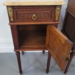 French Oak pair of Louis 16th style marble top bedsides with stunning bronze mounts. They have been sourced from France and are in good original detailed condition.