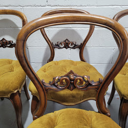 Set of six upholstered Victorian balloon back chairs. In good original detailed condition.