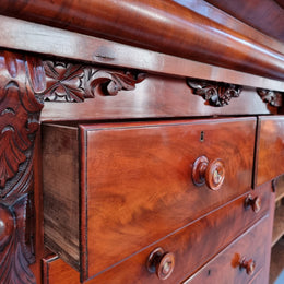 A 19th Century Scottish Flame Mahogany tall boy/ Chest of six drawers. Beautiful carvings and easily comes apart into three sections making transport o0r moving into place easy. In good original detailed condition.