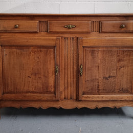 French Oak Early 19th Century sideboard with two doors and three drawers. In good original condition.