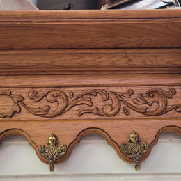 French Oak hanging wall rack with seven hooks. It has been sourced from France and is in good original detailed condition.