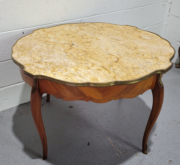 Louis XV style parquetry inlaid coffee table with shaped marble top and ormolu decoration. In good original detailed condition.