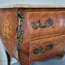 French Louis XV style marquetry inlaid two drawer marble top commode with deorative ormolu trim. In good original detailed condition with working double lock and key.