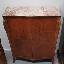 French Louis 15th style Kingwood marquetry inlaid two door cupboard with a beautiful marble top. It has three adjustable shelves and decorative ormolu trim. It has been sourced from France and is in good original detailed condition.