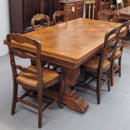 Amazing French Oak Renaissance style parquetry top extension table. Beautiful parquetry top and amazing detailed carvings on the legs. It extends to 306 cm long when fully extended. Sourced from France and in good original detailed condition.