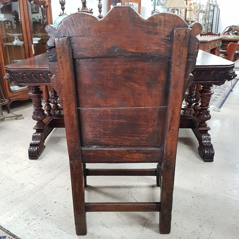 An impressive late 17th century oak, Charles II Wainscot chair, with all original panel timber, solid seat, turned arm supports and original top carved panel. This chair retains it's beautiful patina and comes with upholstered cushion seat.
