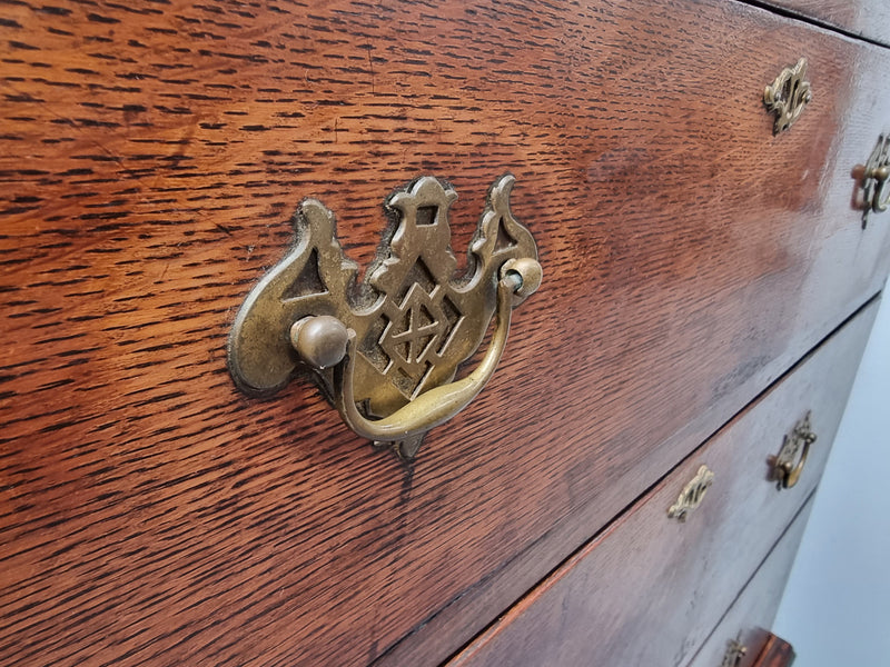 Early 19th Century English Oak chest on stand. It has been sourced in France and has plenty of storage space with eight drawers. In good original detailed condition.