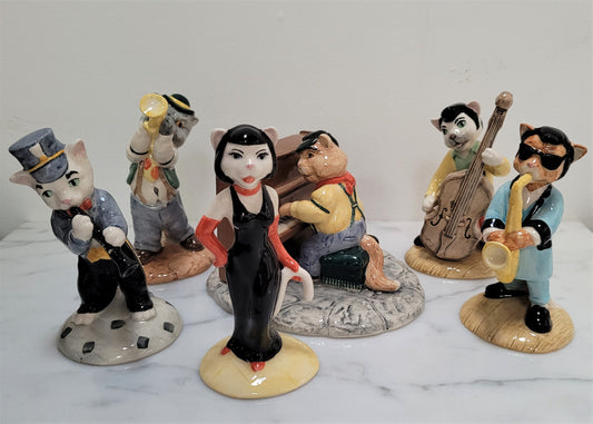 Amazing Beswick cat band figurines. There are 6 figurines including Fat Cat (Piano), Purrfect Pitch, Trad Jazz Tom, Rathcatcher Bilk, One Cool Cat and Cat Walking Bass. They are all in excellent original condition.