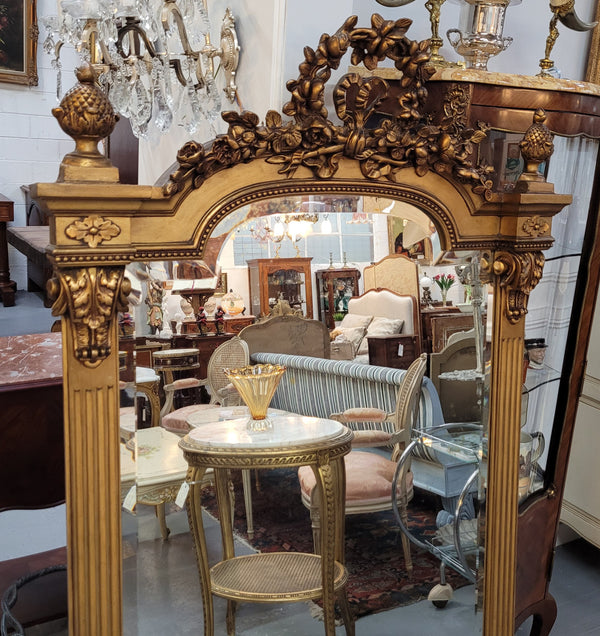 French Louis XVI style Napoleon III (1870’s) gilt mantle mirror. Beautifully carved and decorated with original bevelled mirror showing signs of age. It is in good original detailed condition and has been sourced from France.