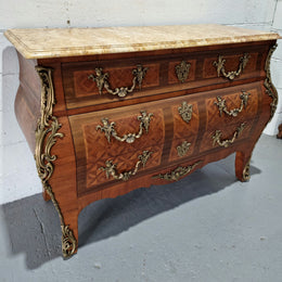 A beautifully inlaid parquetry three drawer commode with a lovely marble top, and decorative ormolu mounts. In good original detailed condition. Circa 1930