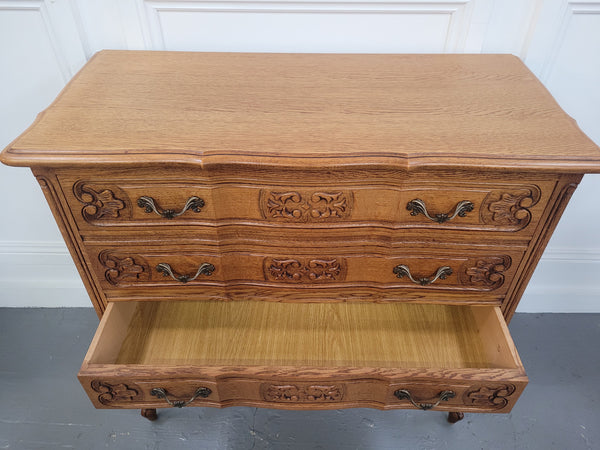 French Oak Louis 15th style nicely carved three drawer wooden top commode. It has been sourced from France and is in good original detailed condition.