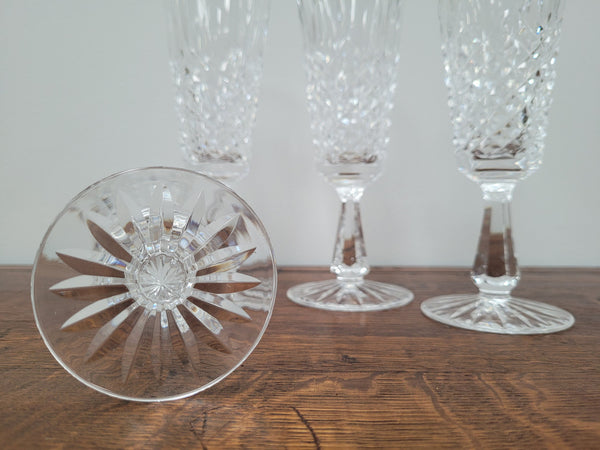 Set of four Waterford “Kenmare” pattern champagne flutes. In good original condition with no chips or cracks.