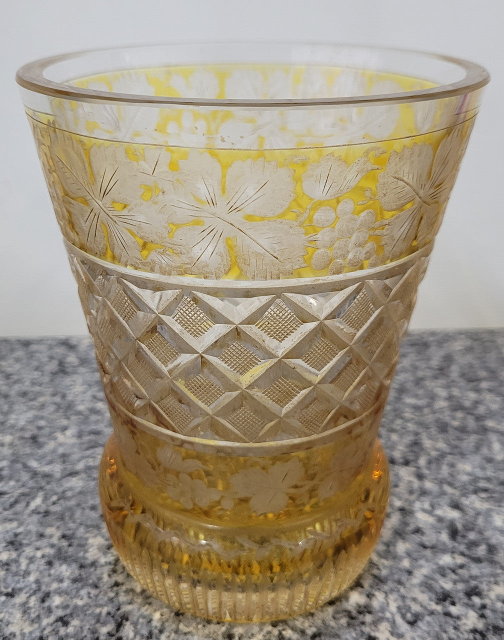 Antique Amber Bohemian acid etched and wheel engraved crystal vase. It has a stunning frieze of vine branches and a star cut base. It is in good original condition, please view photos as they help form part of the description.