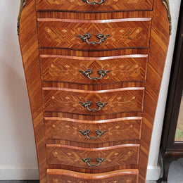 Stunning French seven drawer Kingwood and marquetry inlaid semainier with a beautiful marble top. In good original detailed condition.