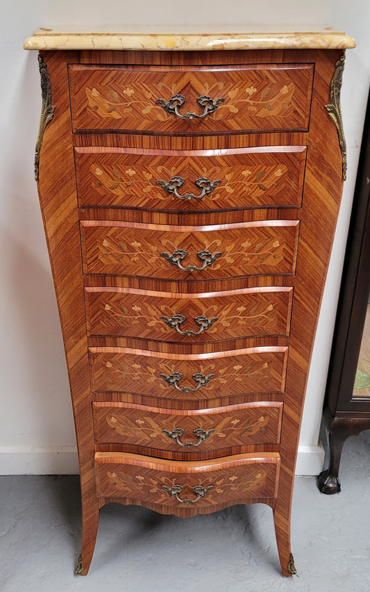 Stunning French seven drawer Kingwood and marquetry inlaid semainier with a beautiful marble top. In good original detailed condition.
