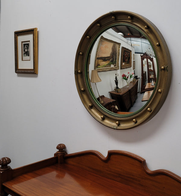 Large round French gilt framed convex mirror. It is a hard to find size with a total diameter of 67 cm. It has been sourced from France and is in good original condition.