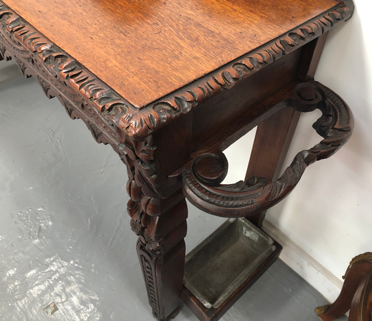 Superb 19th Century Gothic style hall/console table. It has umbrella and walking stick holders on both sides. In good original detailed condition.