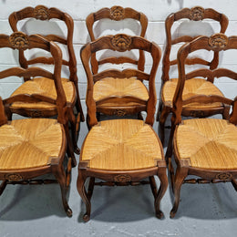 Set of six French Cherrywood rush seat dining chairs. In good restored condition.
