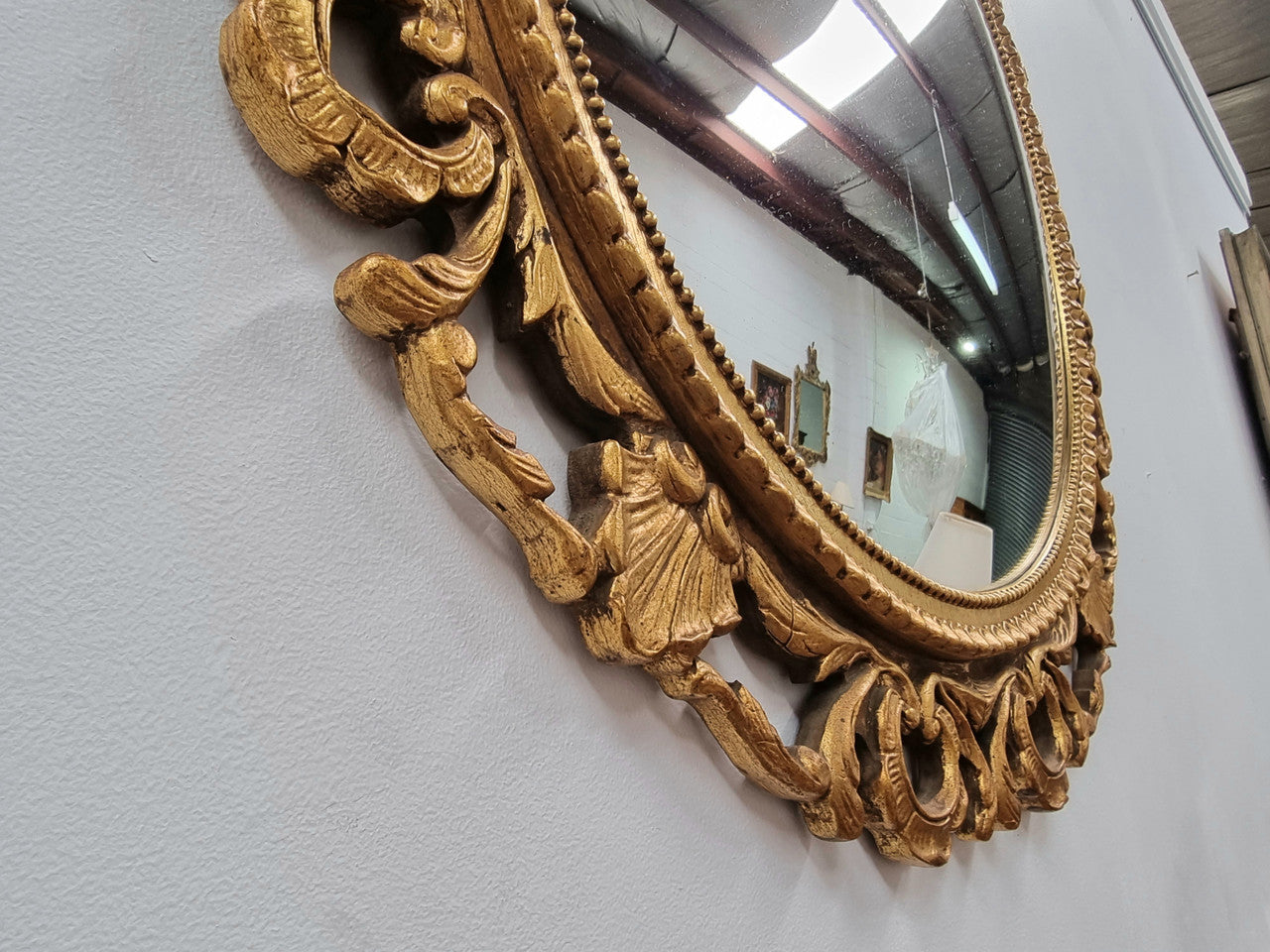 Vintage large round ornate convex mirror. Lovely gilt decoration around and is in good original condition.