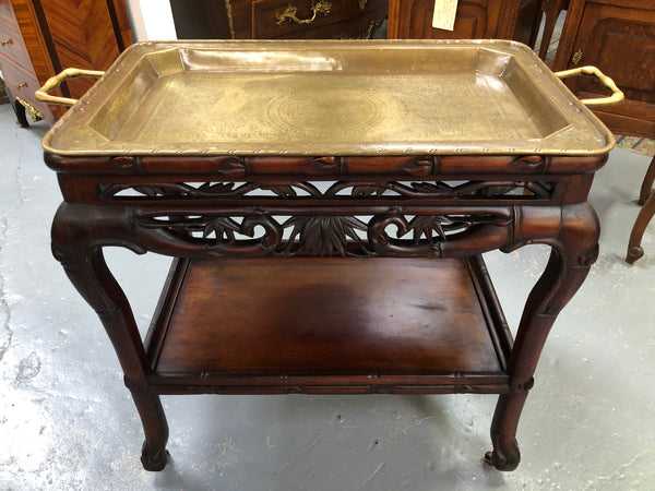 Victorian Rosewood auto/drinks trolley with a very decorative removable brass tray. In very good original detail condition.