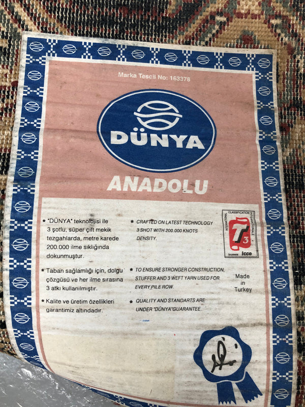 A beautiful coloured Turkish Rug with shades of green, teal, navy and rust in good condition.