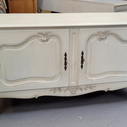 Louis XV style chalk painted two door cabinet which would also make an ideal TV cabinet. It has been sourced from France and in good original detailed condition.