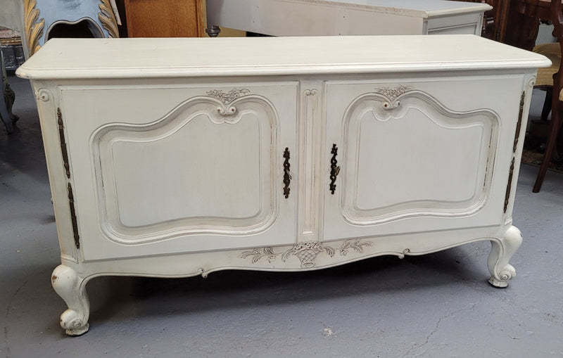 Louis XV style chalk painted two door cabinet which would also make an ideal TV cabinet. It has been sourced from France and in good original detailed condition.