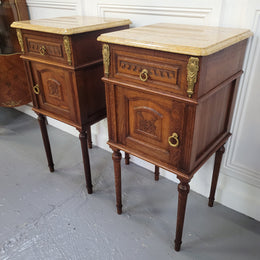 French Oak pair of Louis 16th style marble top bedsides with stunning bronze mounts. They have been sourced from France and are in good original detailed condition.