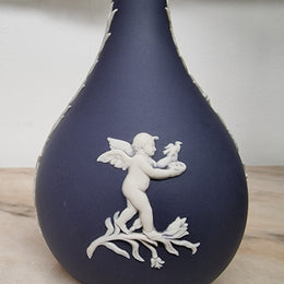 Wedgwood blue and white Jasper Ware bud vase. It is in good original condition with no chips or cracks, please view photos as they help form part of the description.