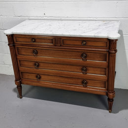 Beautiful French Louis XV Style Marble top five drawer commode. There are five drawers and it has a lovely brass inlay. It is in good original detailed condition.