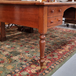 Australian Cedar full partners desk with attractive tooled leather top, four drawers either side and on caster wheels.  In good original detailed condition.