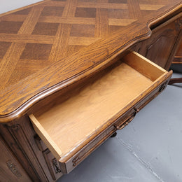 French Oak Louis XV style three door, two drawer, parquetry top sideboard. It has been sourced from France and is in good restored condition.