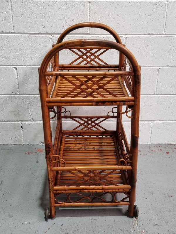 Excellent Vintage Tortoiseshell Bamboo two tier auto trolley. It has been sourced locally and is in fantastic original detailed condition .