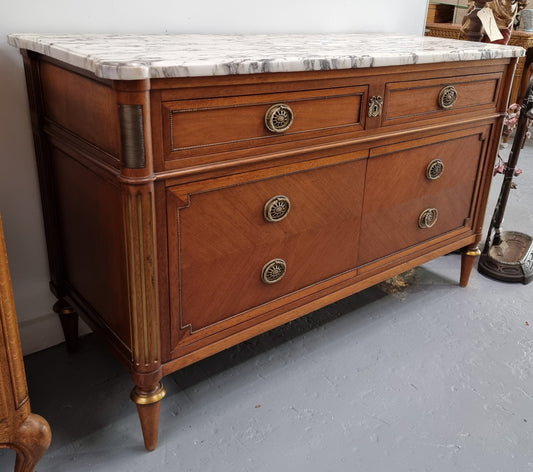 Louis XVI style Mahogany marble top cupboard. It has two drawers at the top and two doors at the bottom all with decorative handles and mounts. Stunning white marble top and all in good original detailed condition.
