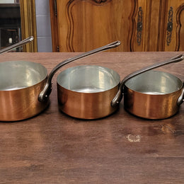 Set of five copper sauce pans with foundry stamp. They have been sourced from France and are in good original detailed condition.