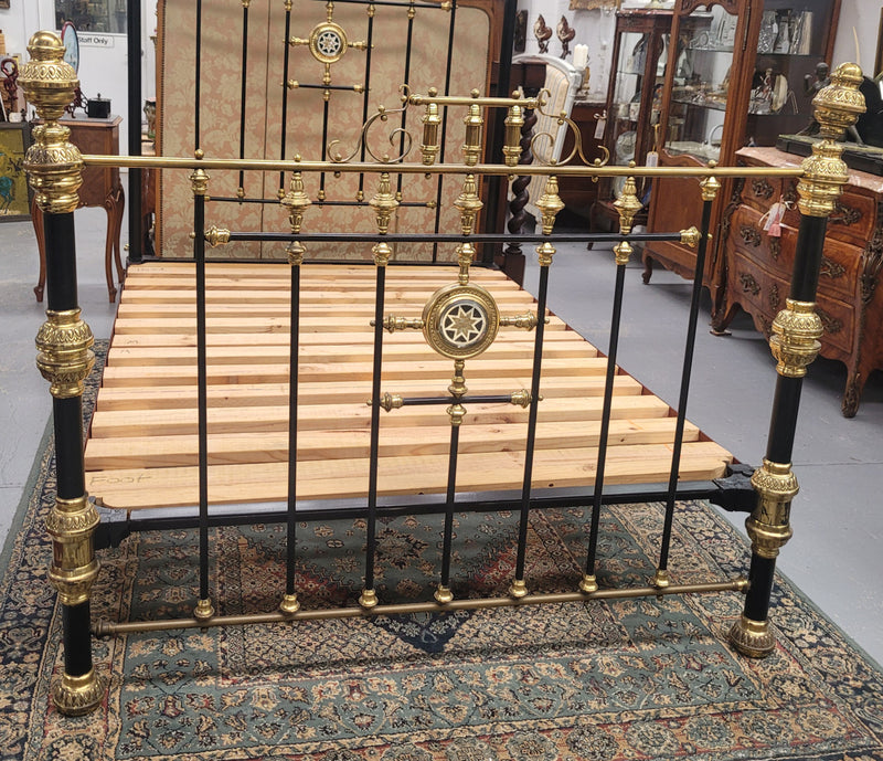 Rare Antique cast iron and brass Victorian queen size bed. Comes with custom made slats.  It has been sourced locally and is in good original condition.