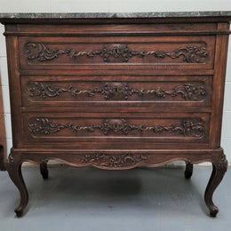 French Oak Louis XV style marble top chest of three drawers. It has beautiful carvings on the drawers with lovely decorative handles all toped with a stunning black and white marble top. In good original detailed condition.