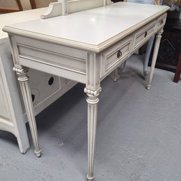 French Louis XVI style painted dresser / console with beveled oval mirror and three drawers. Sourced from France and in good original detailed condition.