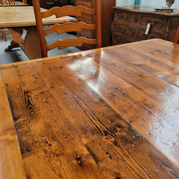 Reclaimed Pine and Oregon stretcher base dining table. The top has an amazing patina and character. Can very comfortable seat 12 and is in good original detailed condition .