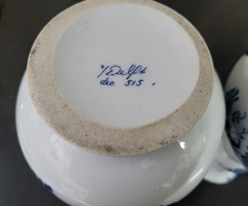 Pair of Victorian delft blue hand painted vases. Stamped underneath and one featuring a ship scene and the other a windmill scene. Please note the windmill vase does have a hairline crack at the top otherwise in good condition, please view photos as they help form part of the description.