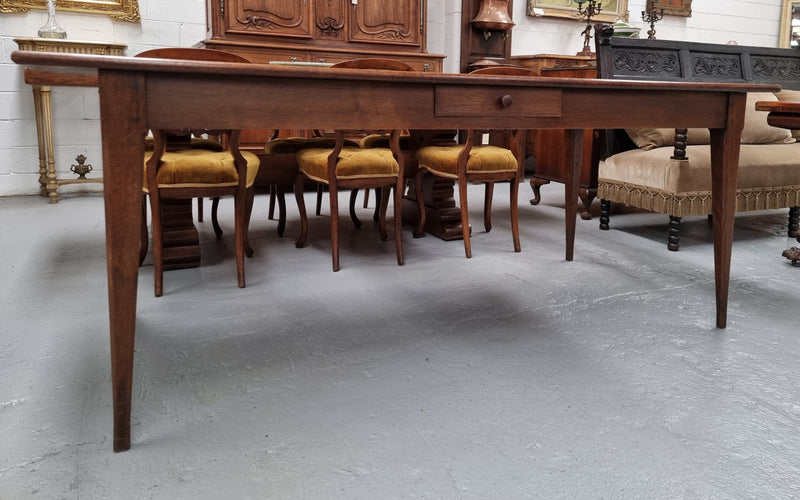 Antique French Oak Farmhouse table in fully restored condition. Features a single drawer and tapered legs.