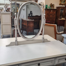French Louis XVI style painted dresser / console with beveled oval mirror and three drawers. Sourced from France and in good original detailed condition.