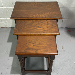 Tudor style English dark Oak nest of three tables. They are in good restored condition.