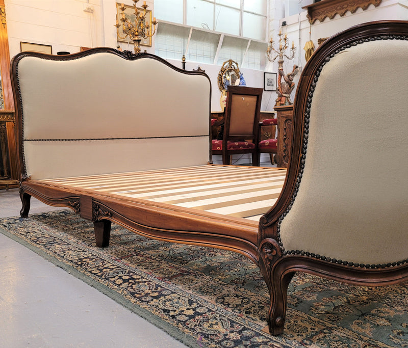 French Louis XV style queen size upholstered bed. Upholstery is in good condition and bed is complete with custom made slats. Just place your mattress on top.