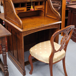 Charming petite English Oak fitted roll top desk. It has a very lovely fitted interior and a drawer at the front ideal for a unit or apartment. Sourced locally and in good original detailed condition.